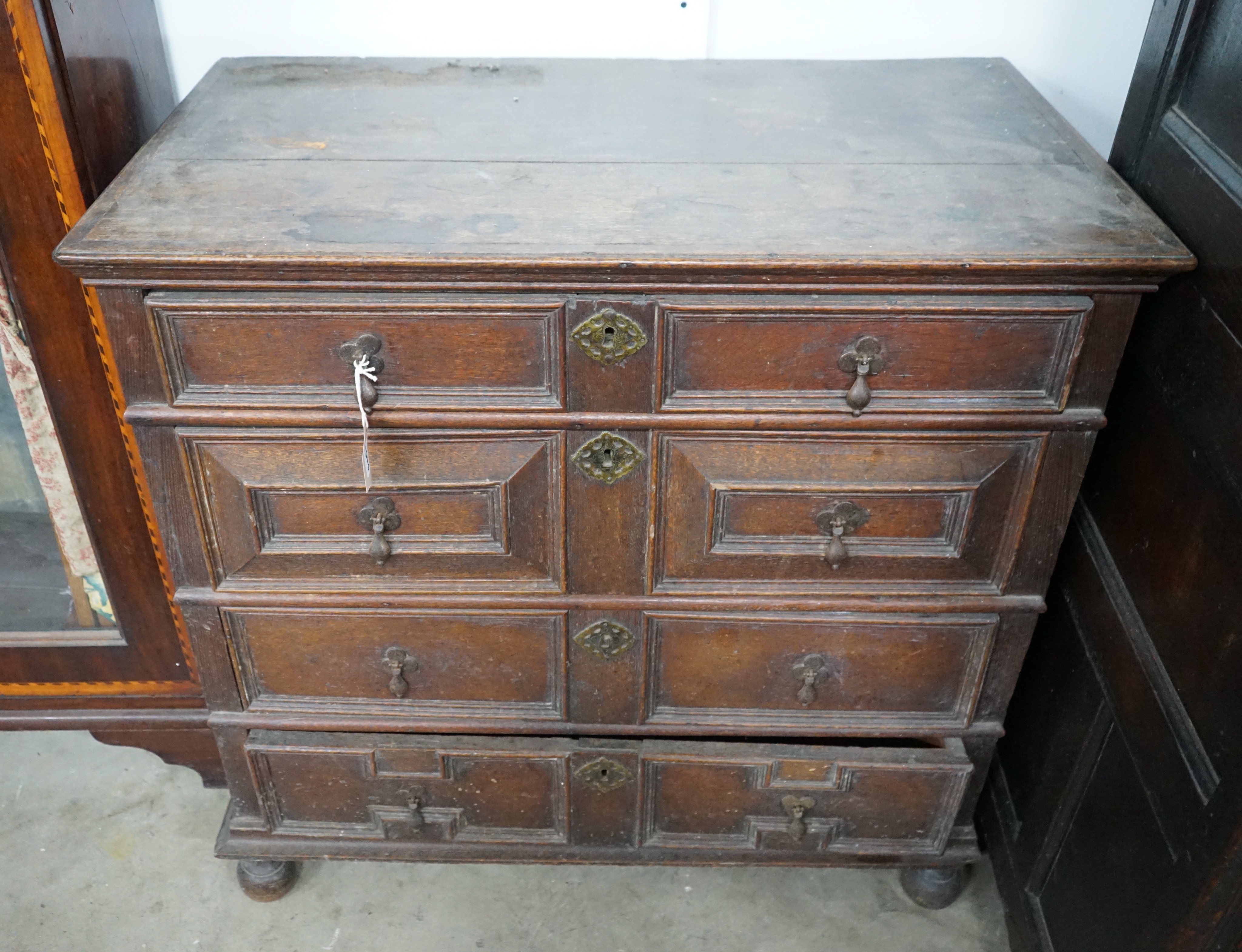 A 17th century oak chest of four drawers, width 93cm, depth 53cm, height 91cm